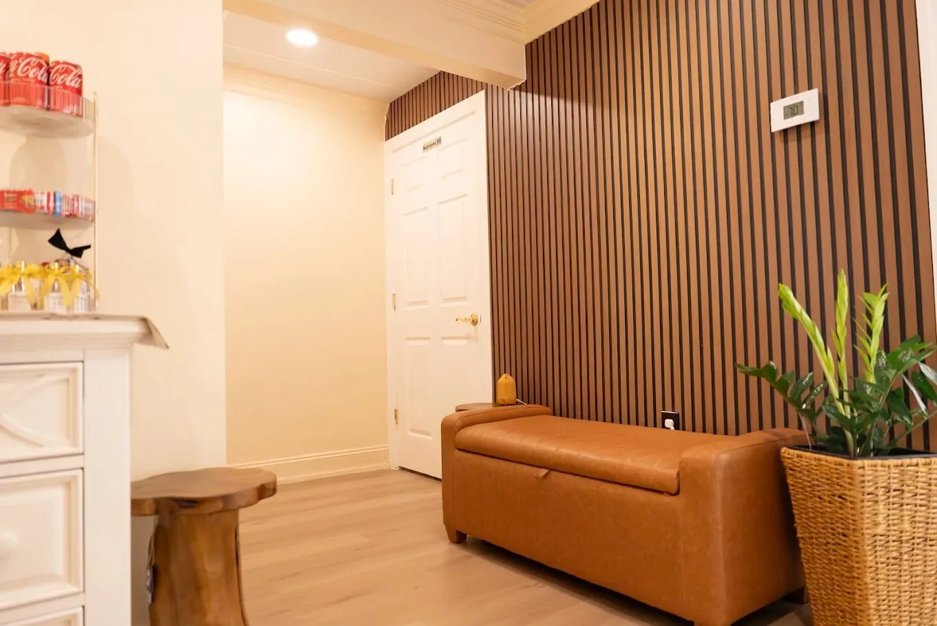The lounge at Sweet & Smile Massage in Daly City, warm lamplight and low seating before a treatment